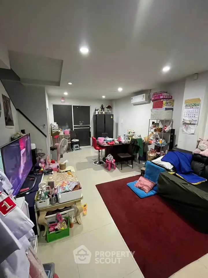 Cozy living room with modern decor and ample natural light