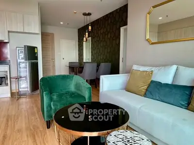 Modern living room with stylish decor and open kitchen layout