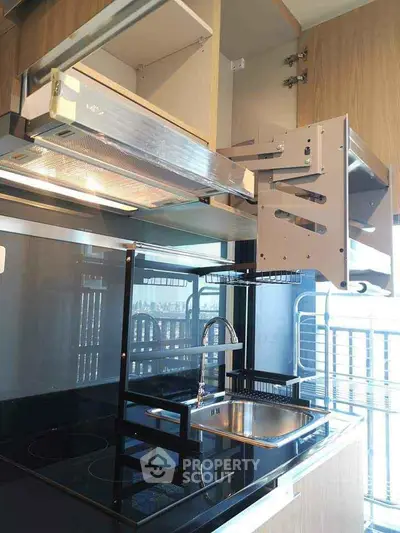 Modern kitchen with sleek cabinetry and innovative pull-out storage solutions.