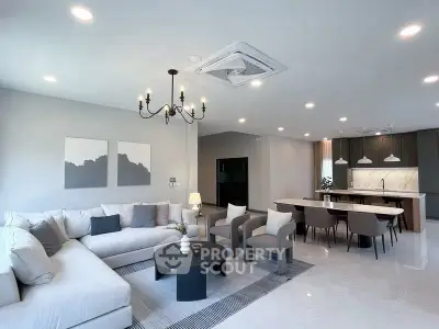 Spacious modern living room with open kitchen and elegant decor