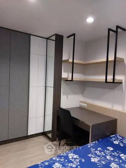Modern bedroom with built-in wardrobe and study desk