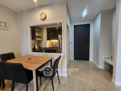 Modern dining area with open kitchen layout and stylish decor