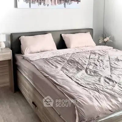 Cozy bedroom with modern decor and stylish bedding in a contemporary apartment.