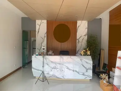Modern reception area with marble desk and stylish decor