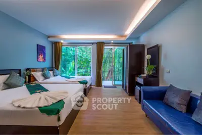 Spacious modern bedroom with twin beds and stylish decor