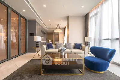 Luxurious modern living room with elegant furniture and large windows