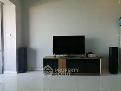 Modern living room with sleek TV setup and minimalist decor