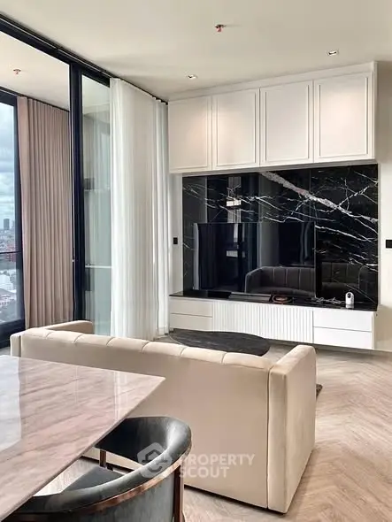 Luxurious modern living room with marble accents and city view.