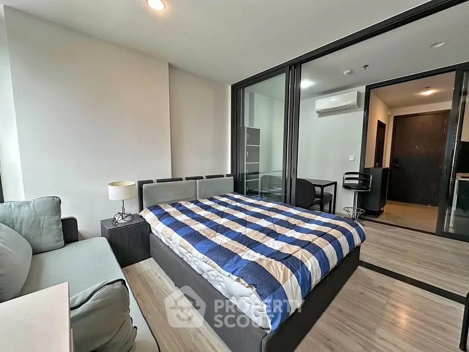 Modern bedroom with stylish decor and cozy ambiance in a contemporary apartment.