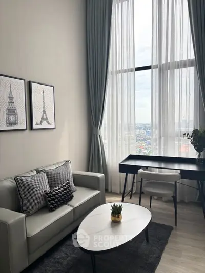 Stylish living room with high ceilings and city view, featuring modern decor and elegant furniture.
