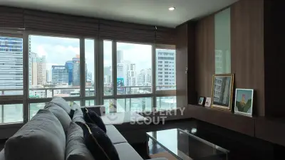 Spacious living room with panoramic city view and modern decor