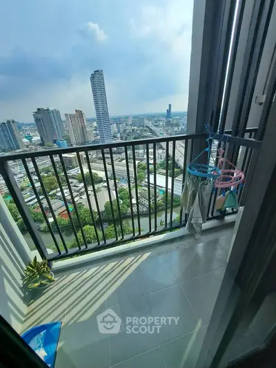 Stunning high-rise balcony with panoramic city views, perfect for urban living enthusiasts.