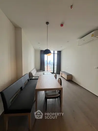 Spacious modern living room with city view and stylish furniture