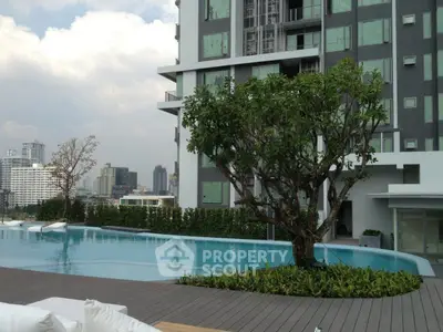 Luxurious condominium with stunning pool and city view, perfect for urban living.