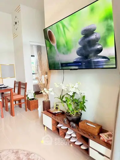 Modern living room with wall-mounted TV and stylish decor