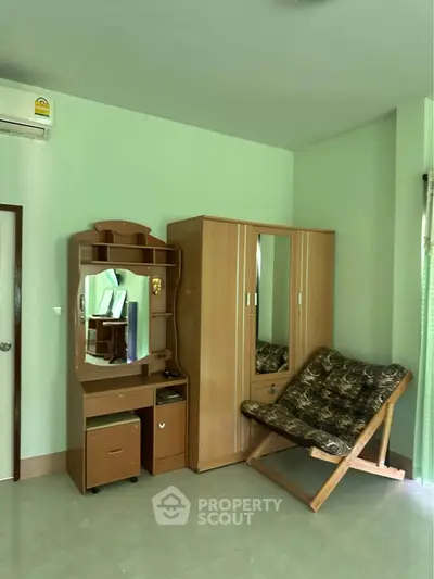 Cozy bedroom with wardrobe and vanity in a serene setting