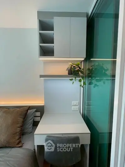 Modern bedroom with sleek study nook and stylish shelving
