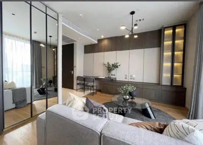 Modern living room with sleek design, featuring a cozy sofa, stylish decor, and ample natural light.