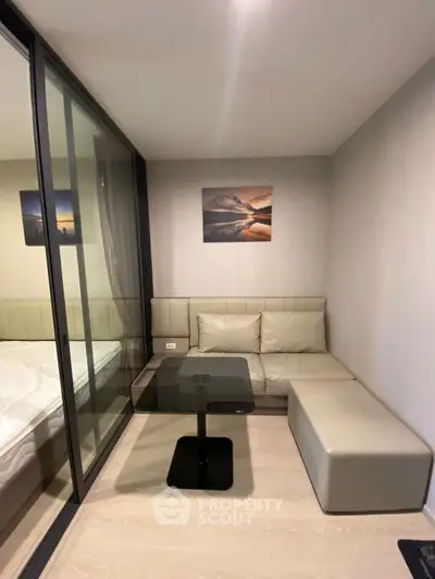 Modern compact living room with glass partition and stylish decor