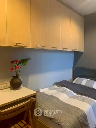 Cozy bedroom with built-in storage and stylish decor