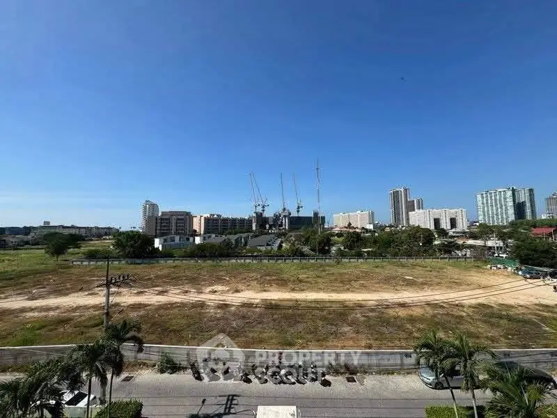 Expansive urban land plot with skyline view, ideal for development opportunities.