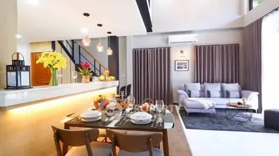 Modern open-plan living room with stylish dining area and contemporary decor