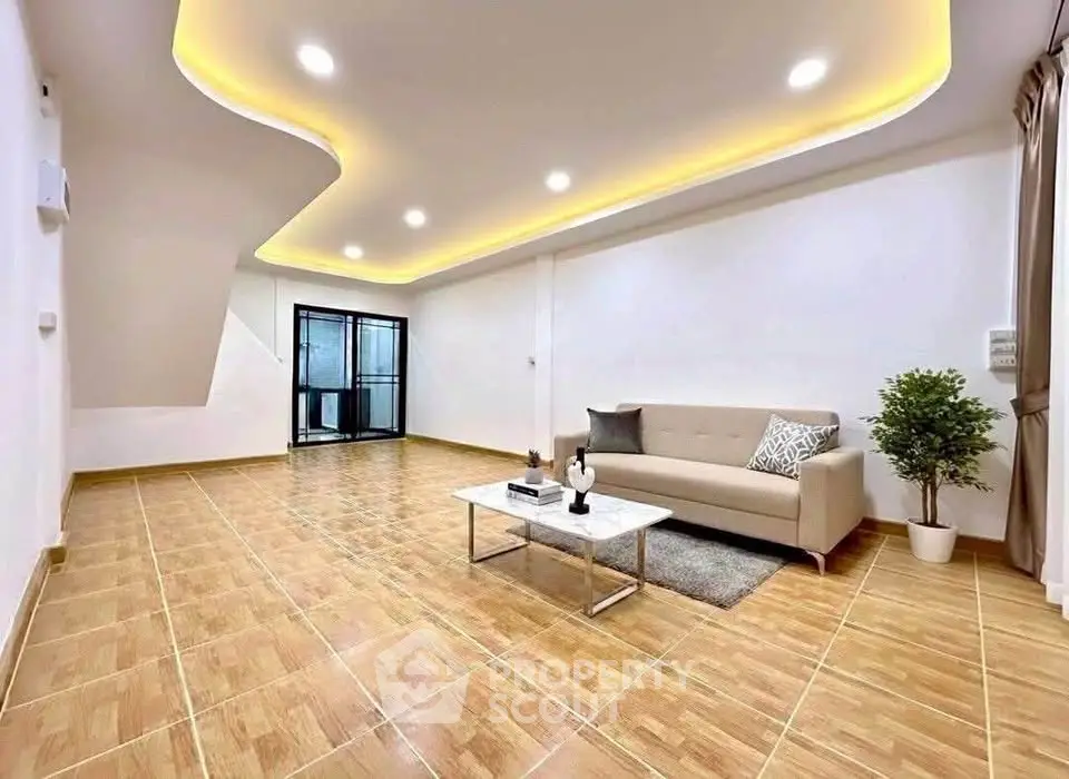 Spacious modern living room with elegant lighting and cozy sofa