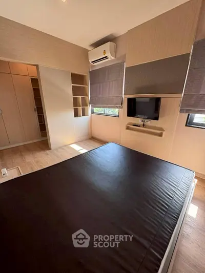 Modern bedroom with sleek design and built-in storage solutions