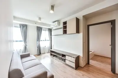 Modern living room with sleek furniture and natural light