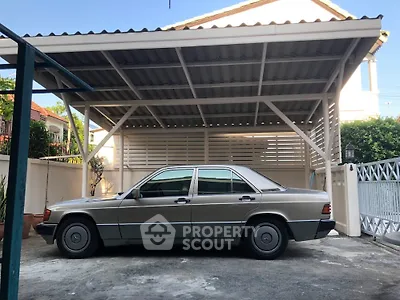 Spacious carport with classic car in residential property