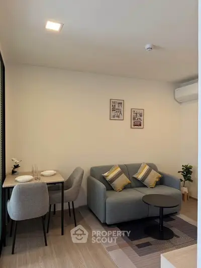 Modern living room with cozy sofa and dining area in stylish apartment