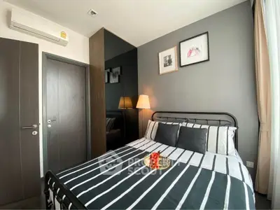 Modern bedroom with stylish decor and cozy ambiance in a contemporary apartment.