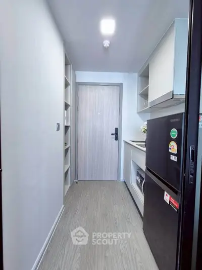 Modern compact kitchen with sleek design and efficient storage solutions.