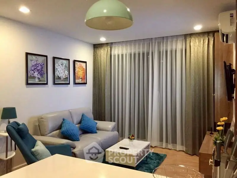 Stylish living room with modern decor, cozy seating, and elegant lighting.