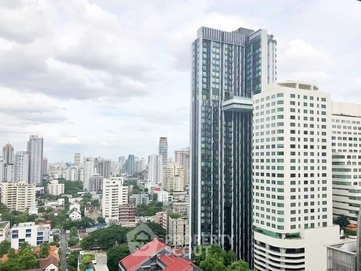 Stunning cityscape view showcasing modern high-rise buildings and lush greenery.