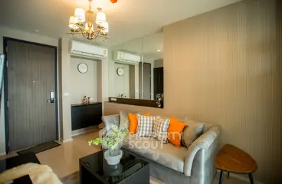 Stylish living room with modern decor and cozy seating in a contemporary apartment.