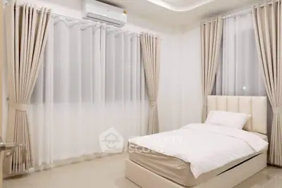 Elegant minimalist bedroom with soft lighting and modern decor