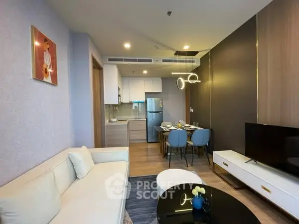 Modern open-layout living room with dining area and stylish decor