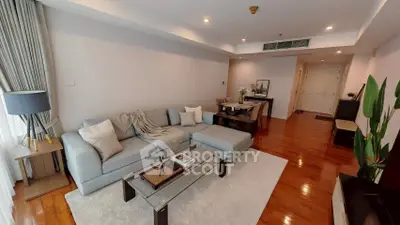 Spacious living room with modern decor and hardwood floors