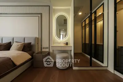 Luxurious bedroom with elegant lighting and mirrored wardrobe