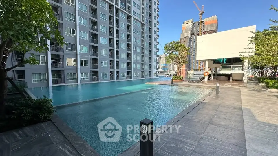 Luxurious modern condominium with stunning pool and city views