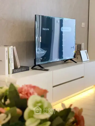 Modern living room with sleek TV setup and elegant decor