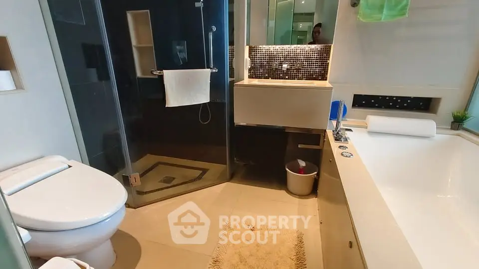Luxurious modern bathroom with glass shower and elegant fixtures