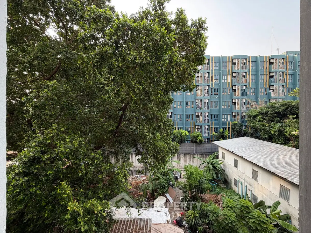 Urban residential view with lush greenery and modern building facade