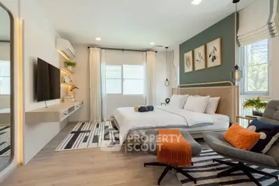 Modern bedroom with stylish decor and natural light