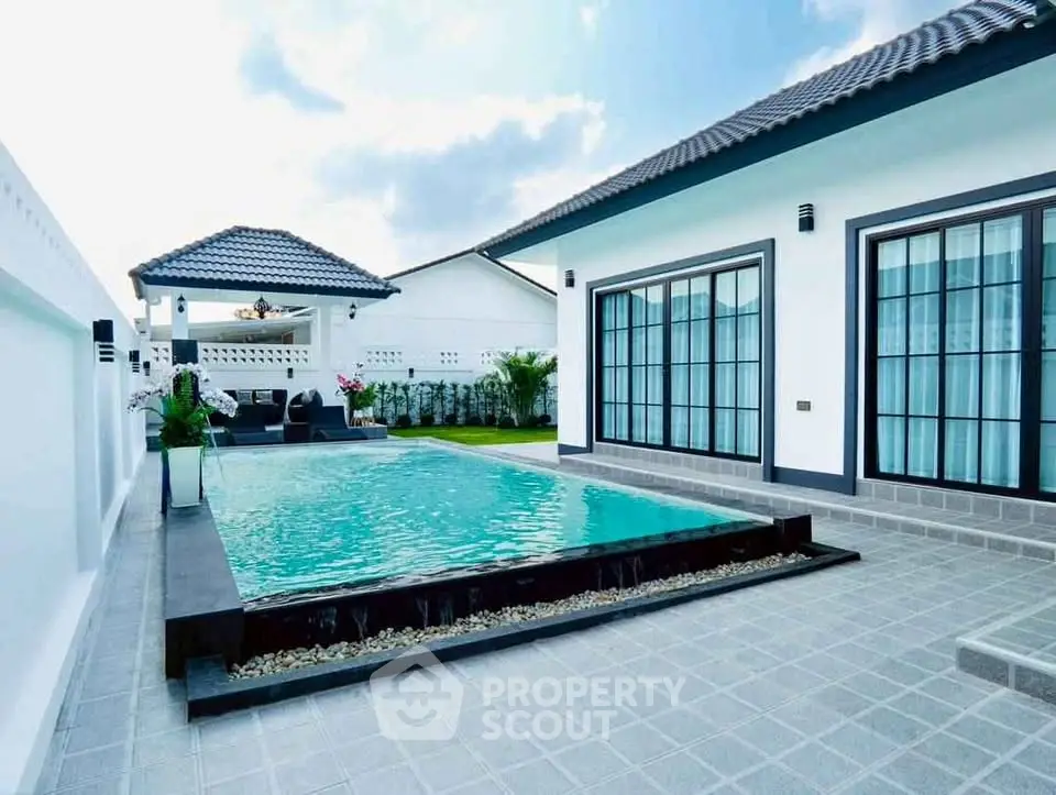 Luxurious modern villa with private pool and spacious outdoor area, perfect for relaxation and entertainment.