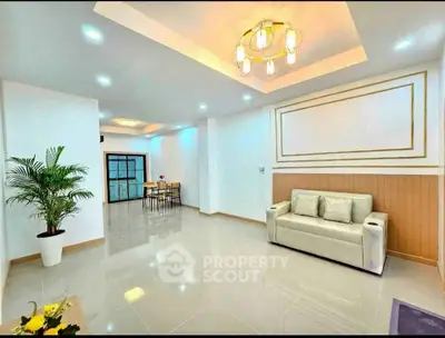 Spacious modern living room with elegant lighting and stylish decor