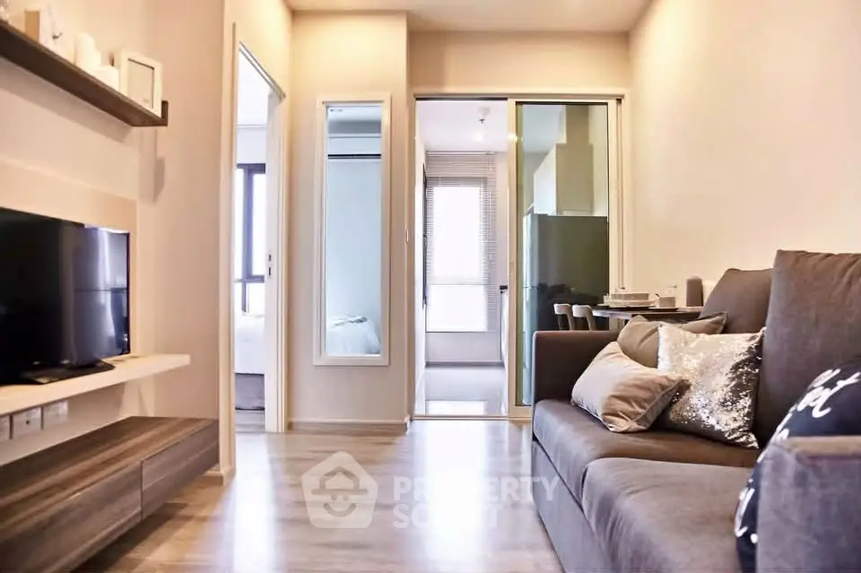 Modern living room with sleek design and cozy ambiance, featuring a comfortable sofa and stylish decor.