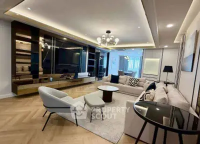 Luxurious modern living room with elegant decor and spacious seating area.