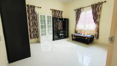 Spacious living room with elegant curtains and modern furniture